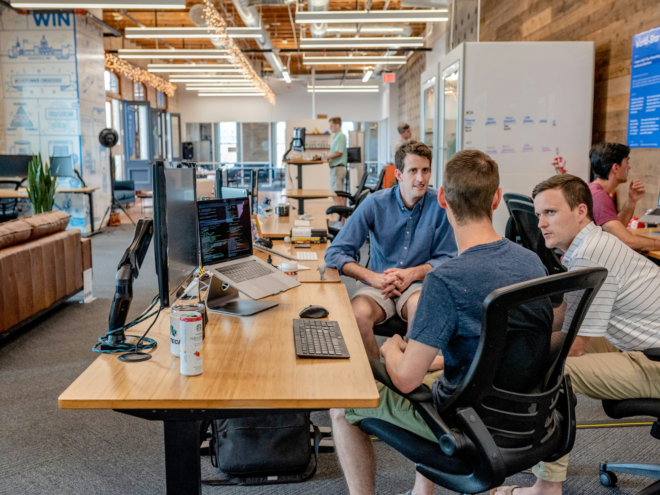 A delivery team reviewing code together at a workstation
